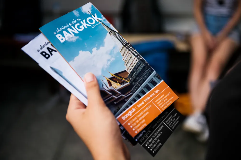 closeup-of-hand-holding-bangkok-travel-guide-broch-2025-02-09-22-56-43-utc