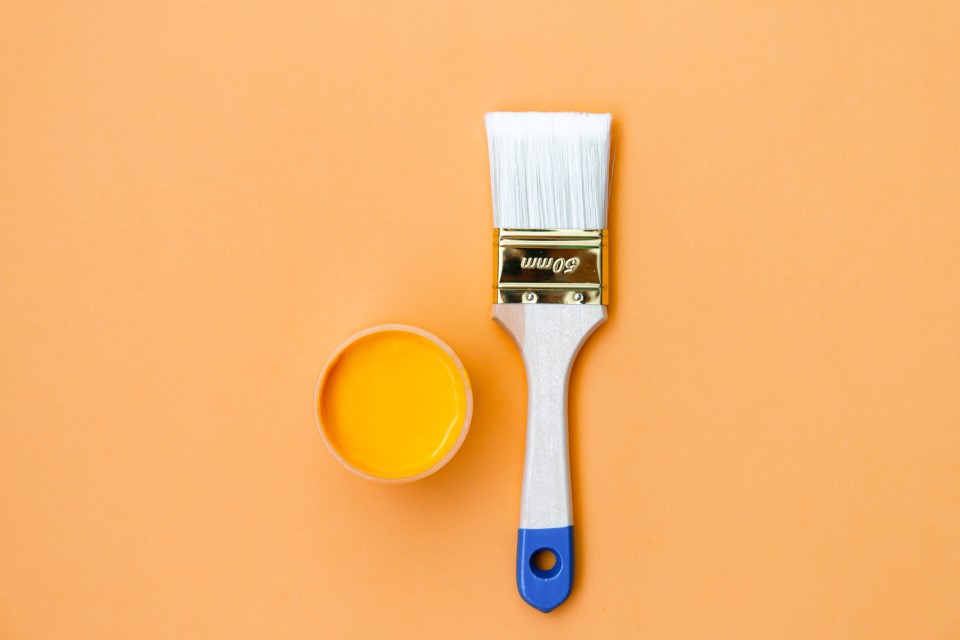 paint-can-and-brush-on-orange-background-house-exlusive-home-improvement-leads